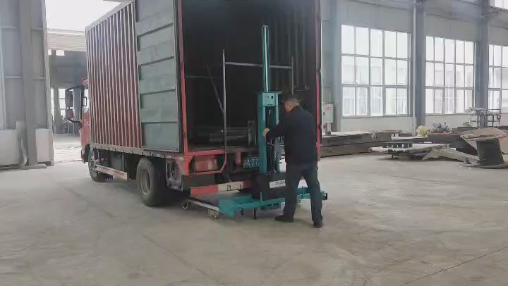 Full-electric self-loading stacker support structure beside a truck loading edge
